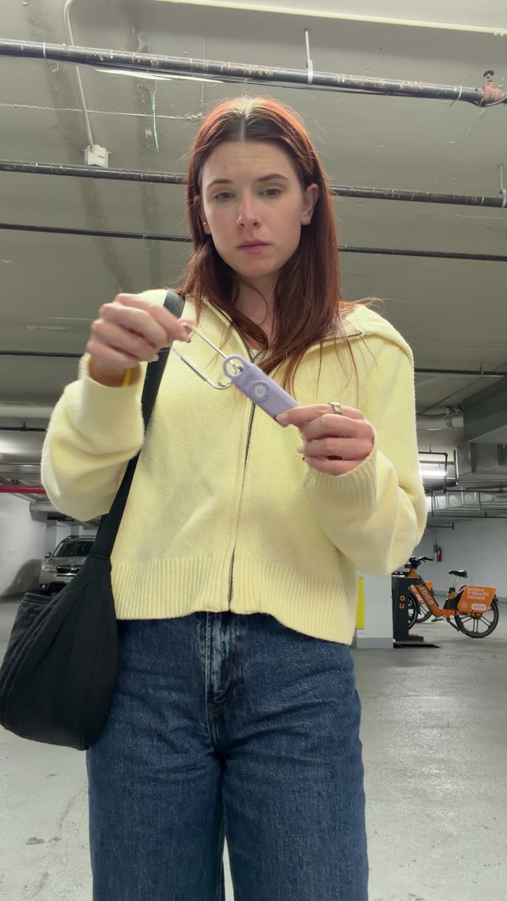 Woman in a parking garage holding Sally