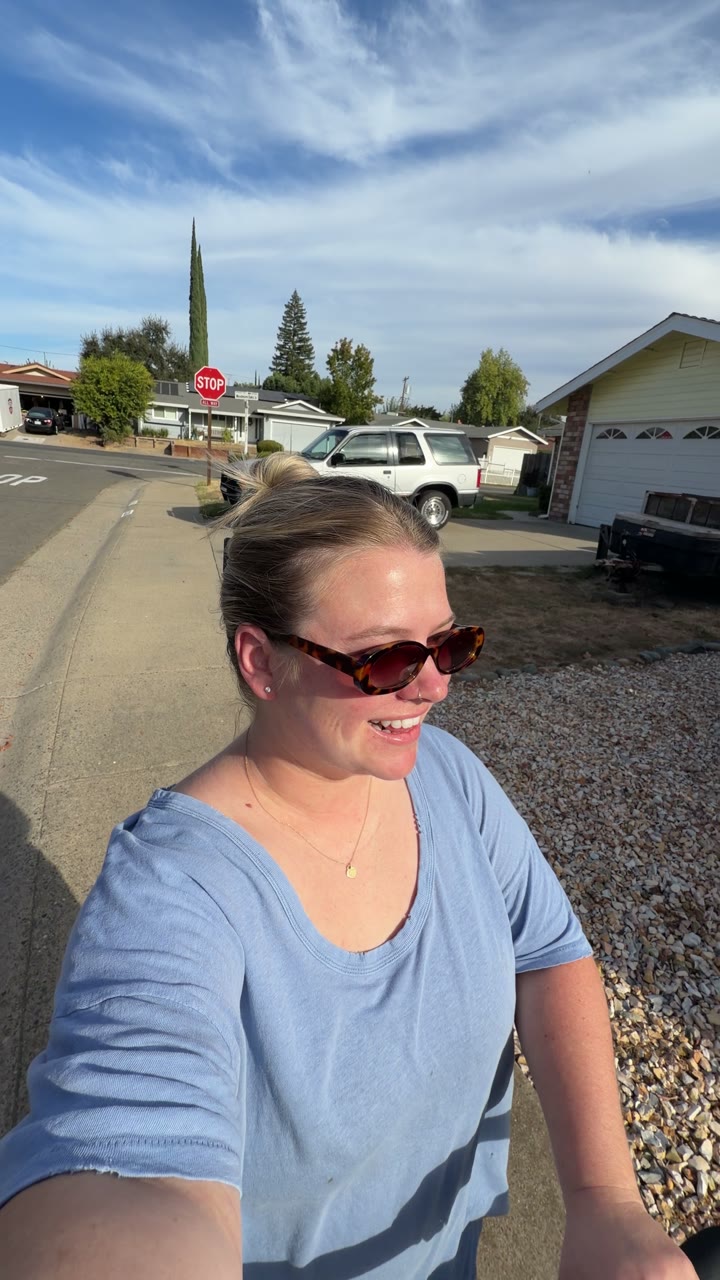 Woman in sunglasses smiling on a walk