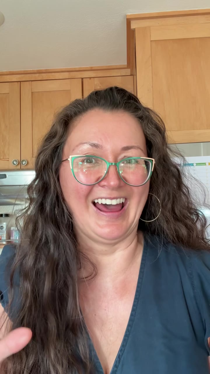 Woman smiling in her kitchen